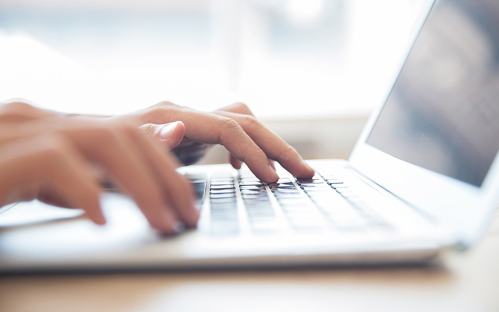 Person checking laptop